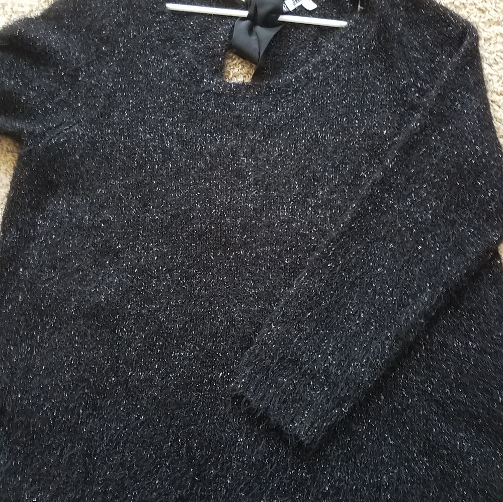 Jennifer Lopez black shimmery sweater